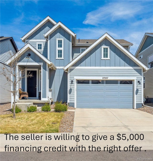view of front facade featuring board and batten siding, an attached garage, and driveway