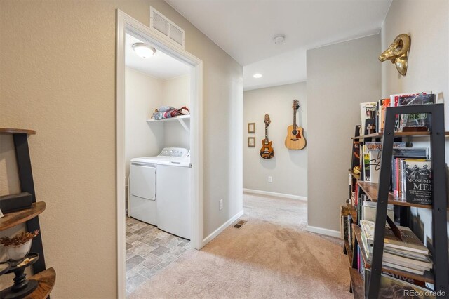 27837 E 8th Ave, Aurora, CO 80018 - hall featuring independent washer and dryer, light colored carpet, baseboards, and visible vents