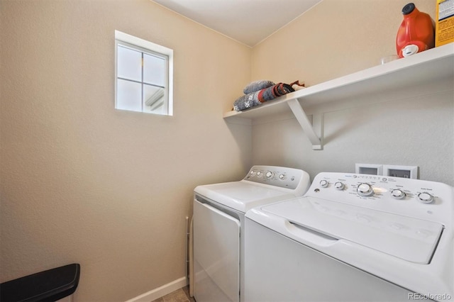 laundry room featuring laundry area, washing machine and dryer, and baseboards