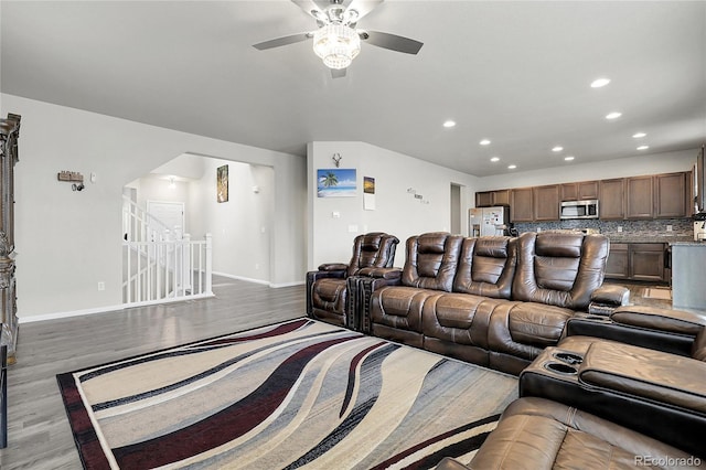6484 N Ceylon Ct, Denver, CO 80249 - living area with wood finished floors, recessed lighting, a ceiling fan, baseboards, and arched walkways