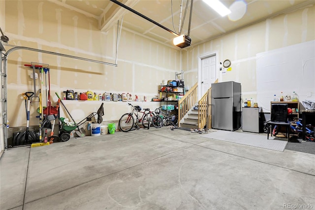 6484 N Ceylon Ct, Denver, CO 80249 - garage with freestanding refrigerator and a garage door opener
