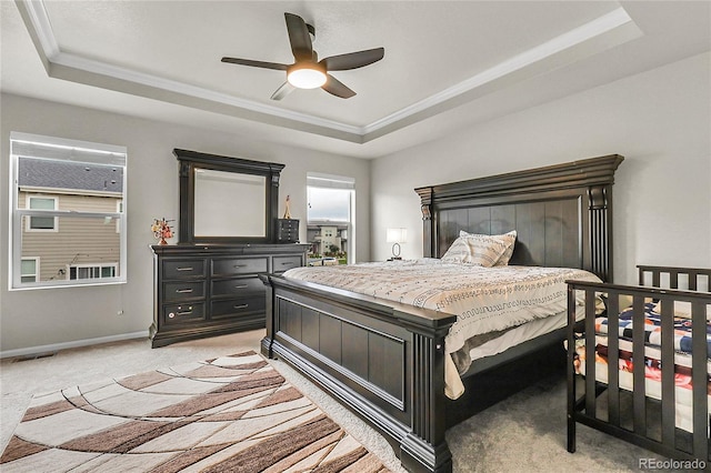 6484 N Ceylon Ct, Denver, CO 80249 - bedroom with a raised ceiling, light carpet, baseboards, ornamental molding, and a ceiling fan