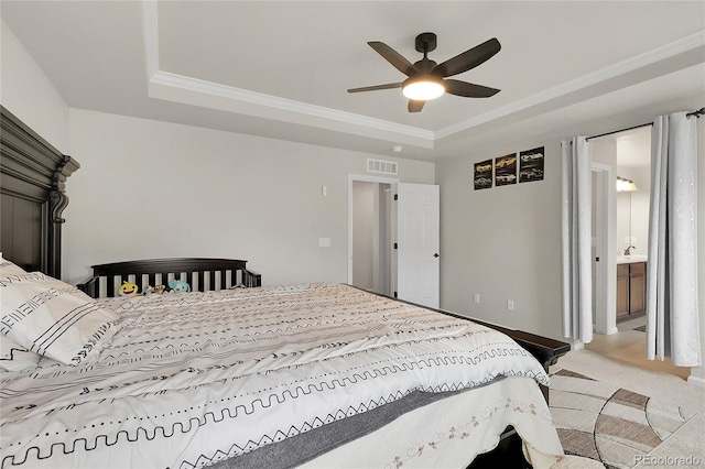 6484 N Ceylon Ct, Denver, CO 80249 - bedroom featuring a tray ceiling, light colored carpet, ornamental molding, a ceiling fan, and baseboards