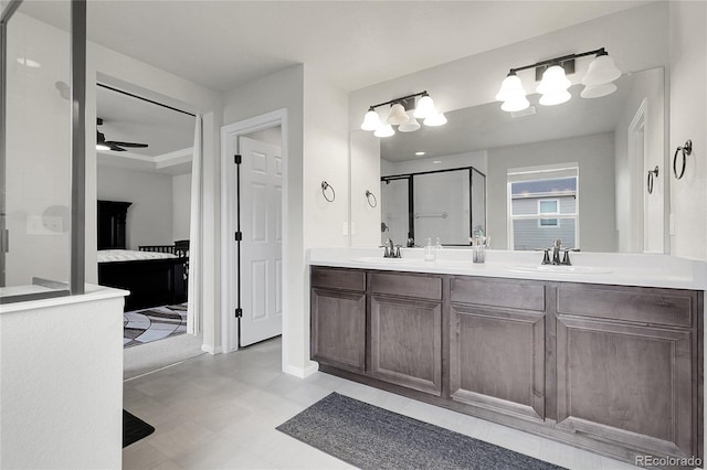 6484 N Ceylon Ct, Denver, CO 80249 - bathroom with a shower stall, double vanity, ceiling fan, and tile patterned floors