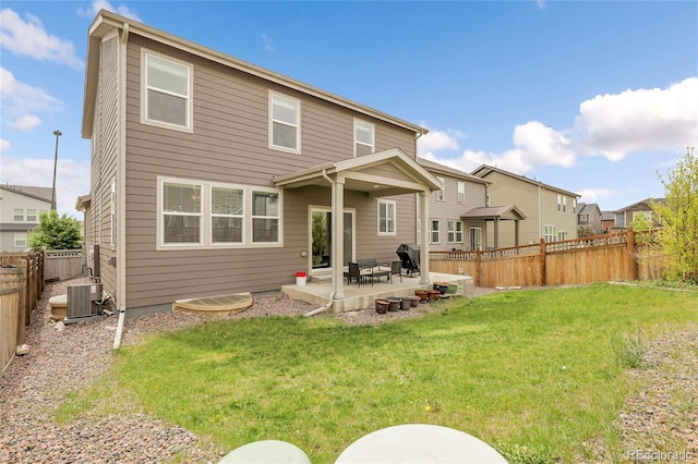 6484 N Ceylon Ct, Denver, CO 80249 - rear view of house featuring central AC unit and a patio