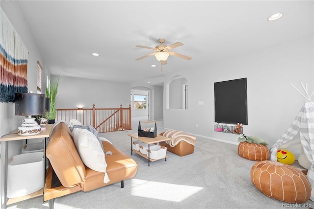 living room featuring ceiling fan and carpet flooring