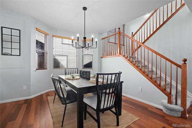 dining room featuring hardwood / wood-style floors and a notable chandelier