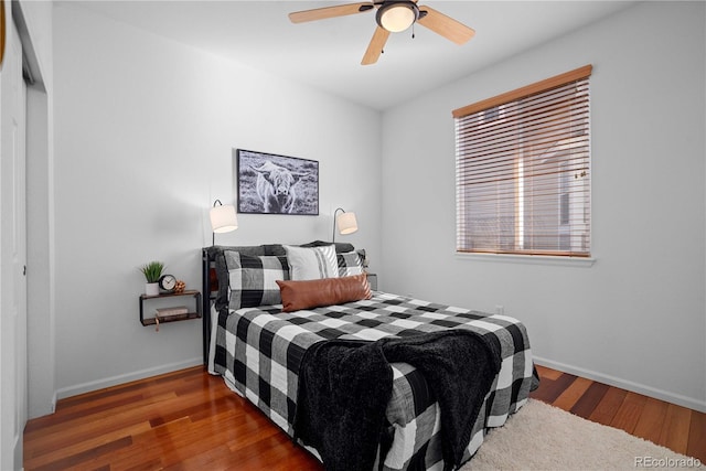 bedroom featuring ceiling fan and hardwood / wood-style floors