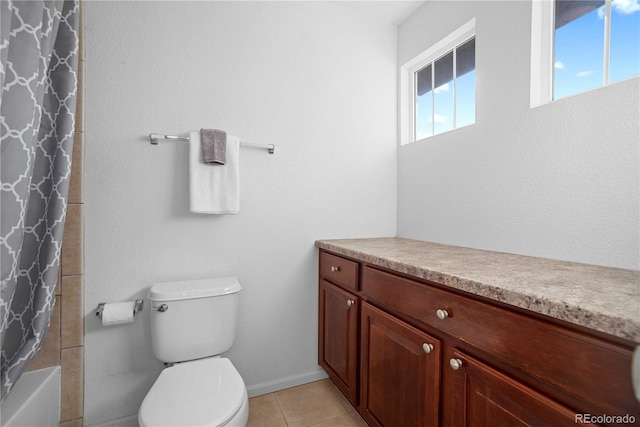 full bathroom with tile patterned flooring, vanity, shower / bath combo, and toilet