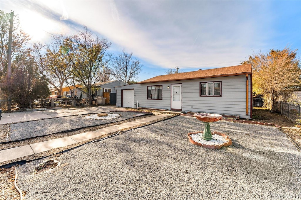 ranch-style home with a garage