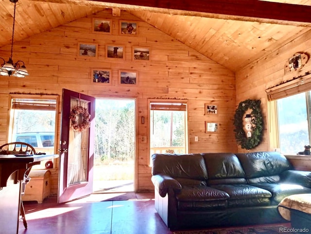 living room with a wealth of natural light, wooden ceiling, and wood walls