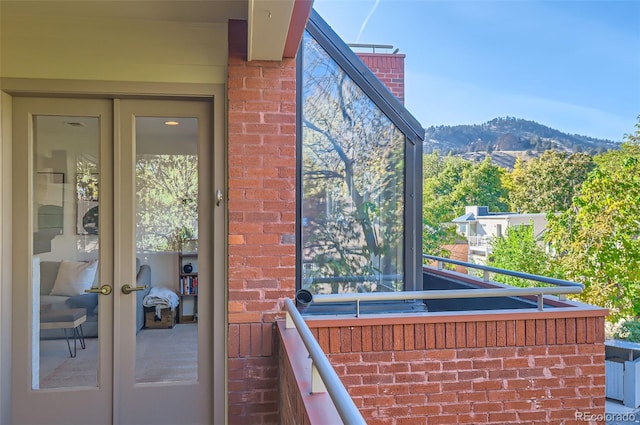 exterior space featuring a mountain view and french doors