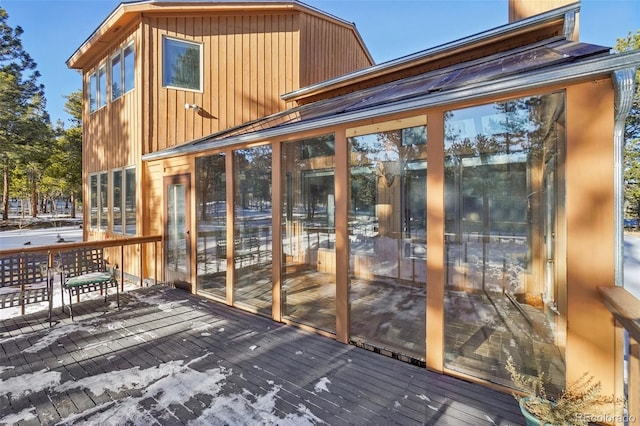 deck with a sunroom