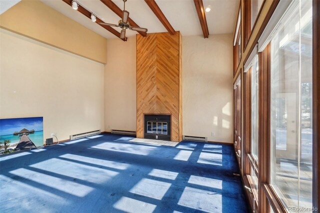 carpeted living room featuring beamed ceiling, ceiling fan, wood walls, and a baseboard radiator