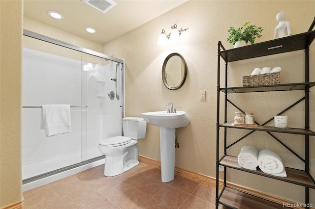 13909 Stone Chimney Ln, Pine, CO 80470 - full bathroom featuring a shower stall, tile patterned floors, a textured wall, and recessed lighting