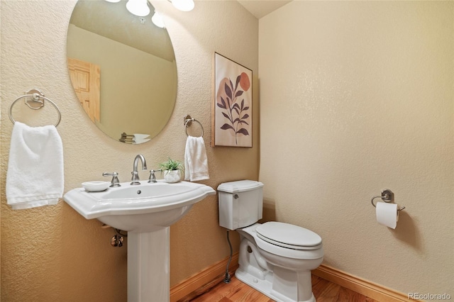 13909 Stone Chimney Ln, Pine, CO 80470 - bathroom featuring wood finished floors and toilet