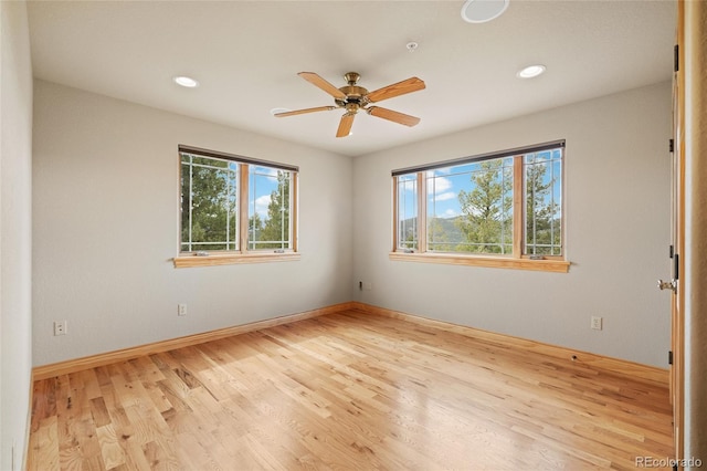 13909 Stone Chimney Ln, Pine, CO 80470 - unfurnished room with healthy amount of natural light, wood finished floors, ceiling fan, and recessed lighting