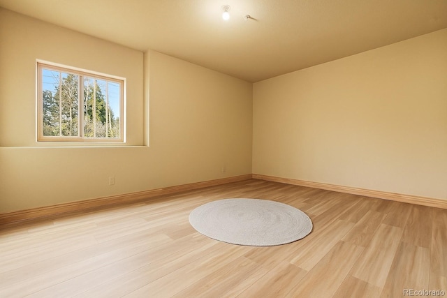 13909 Stone Chimney Ln, Pine, CO 80470 - empty room with light wood-style flooring and baseboards