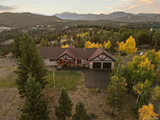 13909 Stone Chimney Ln, Pine, CO 80470 - aerial view of property and surrounding area featuring a mountainous background