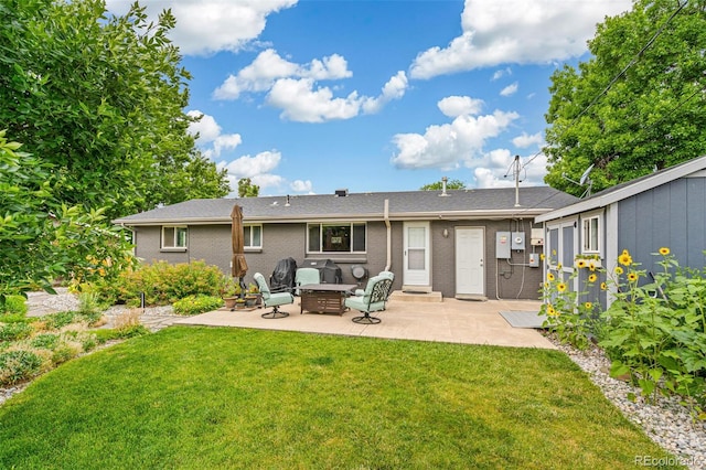6066 Simms St, Arvada, CO 80004 - back of property with a patio area, a yard, a fire pit, and brick siding