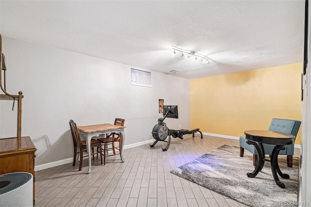 6066 Simms St, Arvada, CO 80004 - exercise room with wood finished floors and a textured ceiling
