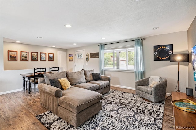 6066 Simms St, Arvada, CO 80004 - living room with wood finished floors, recessed lighting, and a textured ceiling