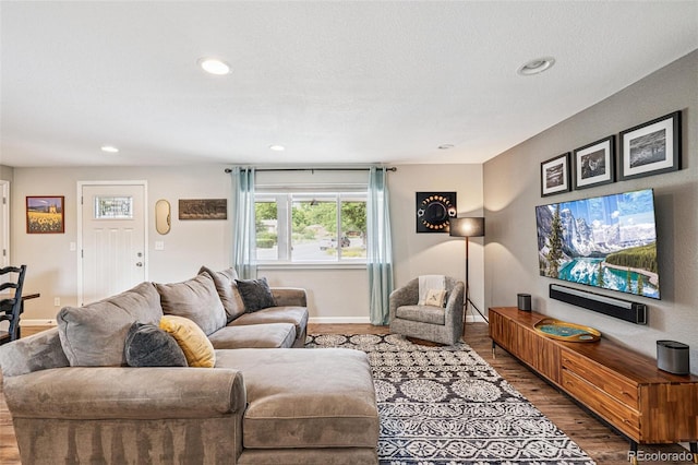 6066 Simms St, Arvada, CO 80004 - living area featuring wood finished floors, recessed lighting, and a textured ceiling