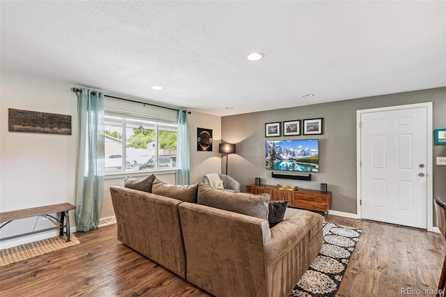 6066 Simms St, Arvada, CO 80004 - living area featuring wood finished floors, recessed lighting, and a textured ceiling