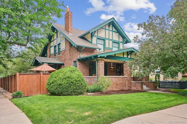 2201 Cherry St, Denver, CO 80207 - view of front of house with brick siding, a chimney, covered porch, and a shingled roof