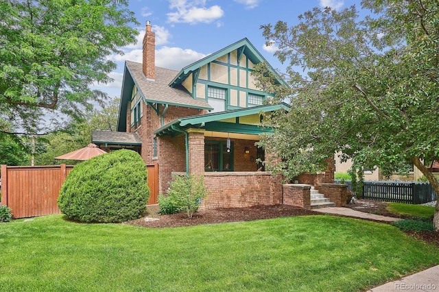 2201 Cherry St, Denver, CO 80207 - rear view of house featuring a chimney, brick siding, a porch, and roof with shingles