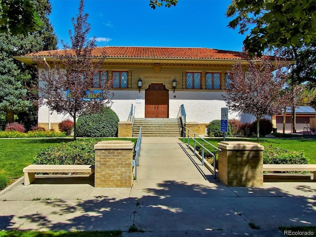 2201 Cherry St, Denver, CO 80207 - mediterranean / spanish-style home featuring a tile roof and stucco siding