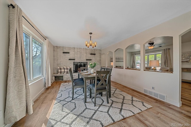 18263 E Mansfield Ave, Aurora, CO 80013 - dining room with wood finished floors, baseboards, and a chandelier