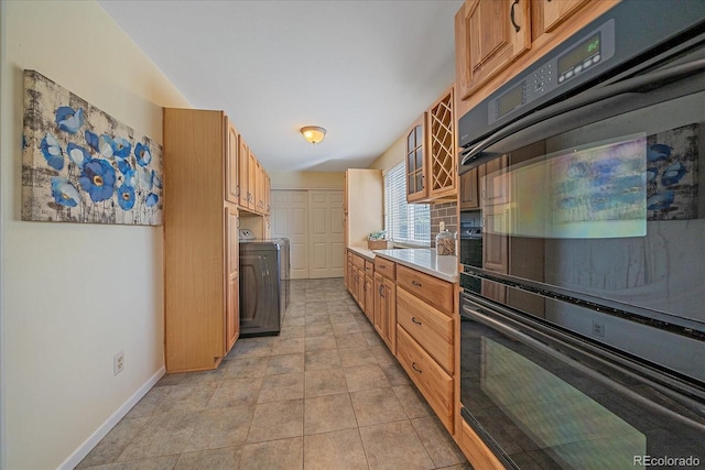 18263 E Mansfield Ave, Aurora, CO 80013 - kitchen featuring light countertops, glass insert cabinets, and baseboards