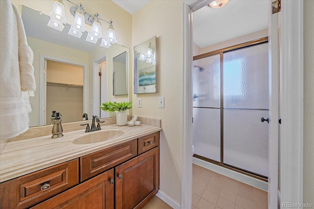 18263 E Mansfield Ave, Aurora, CO 80013 - full bathroom with vanity, a stall shower, tile patterned flooring, and toilet