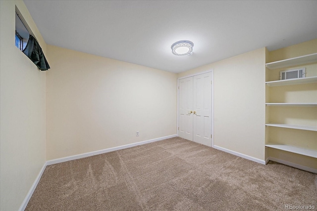 18263 E Mansfield Ave, Aurora, CO 80013 - unfurnished bedroom with carpet flooring, baseboards, and a closet