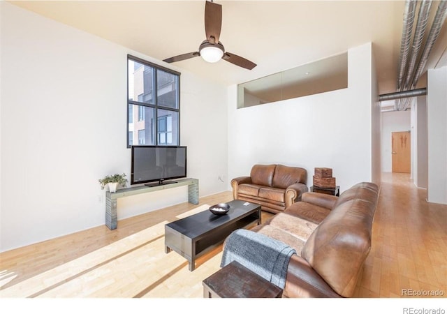 3100 Huron St Unit 3P, Denver, CO 80202 - living area featuring wood finished floors and a ceiling fan