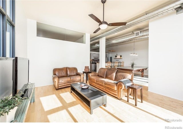 3100 Huron St Unit 3P, Denver, CO 80202 - living room with wood finished floors and ceiling fan