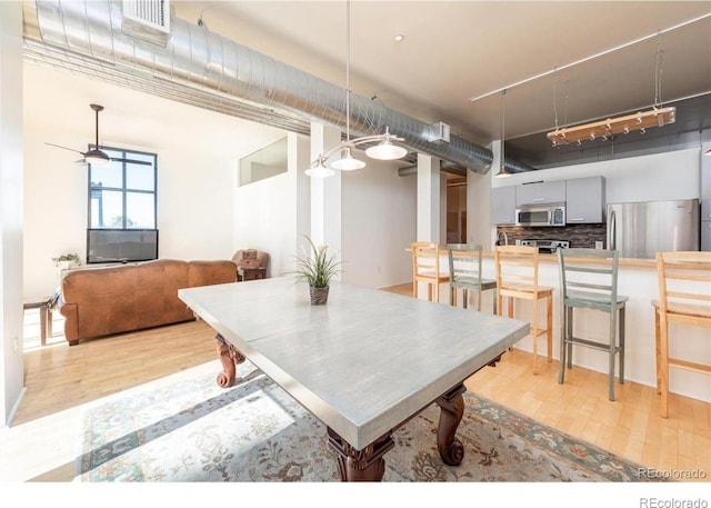 3100 Huron St Unit 3P, Denver, CO 80202 - dining room with track lighting and light wood finished floors
