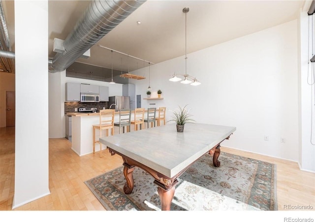 3100 Huron St Unit 3P, Denver, CO 80202 - dining space with light wood-style flooring