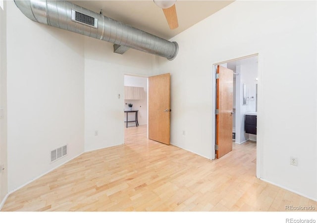 3100 Huron St Unit 3P, Denver, CO 80202 - unfurnished room featuring wood finished floors and a high ceiling
