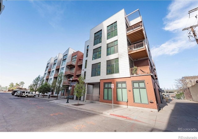 3100 Huron St Unit 3P, Denver, CO 80202 - view of apartment building / complex with uncovered parking