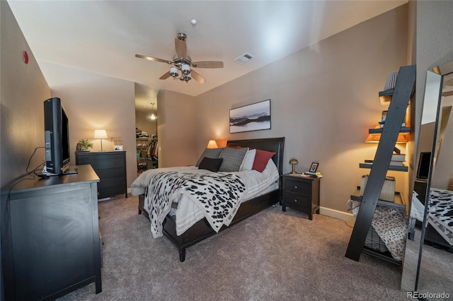 bedroom featuring carpet floors, visible vents, a spacious closet, ceiling fan, and baseboards