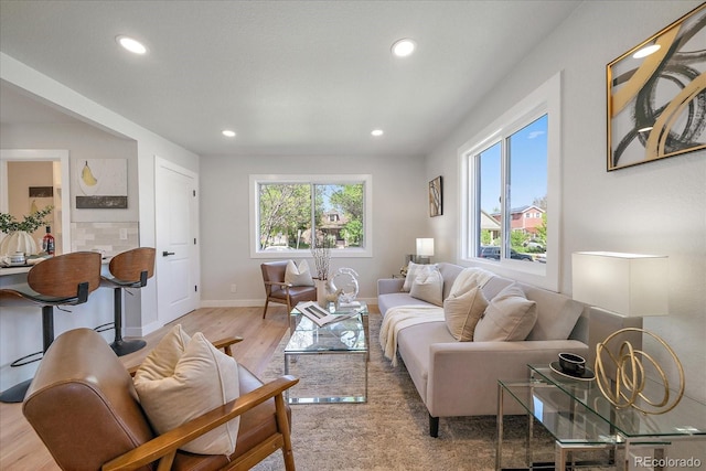3206 Elizabeth St, Denver, CO 80205 - living room with plenty of natural light, recessed lighting, wood finished floors, and baseboards