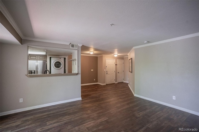 12208 W Dorado Pl Unit 207, Littleton, CO 80127 - empty room featuring stacked washer / drying machine, dark wood-type flooring, ornamental molding, and a textured ceiling