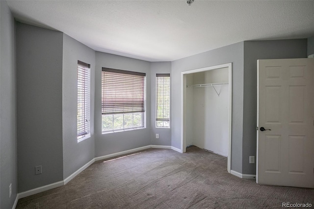 12208 W Dorado Pl Unit 207, Littleton, CO 80127 - unfurnished bedroom featuring carpet and a closet