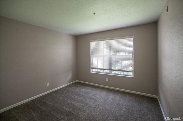 12208 W Dorado Pl Unit 207, Littleton, CO 80127 - spare room featuring dark colored carpet and a pendent fire sprinkler