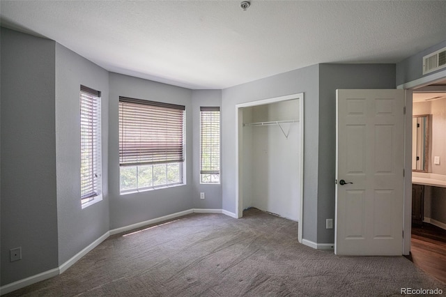 12208 W Dorado Pl Unit 207, Littleton, CO 80127 - unfurnished bedroom featuring carpet and a closet