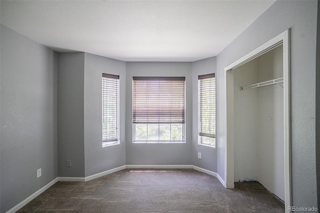12208 W Dorado Pl Unit 207, Littleton, CO 80127 - unfurnished bedroom with carpet floors and a closet
