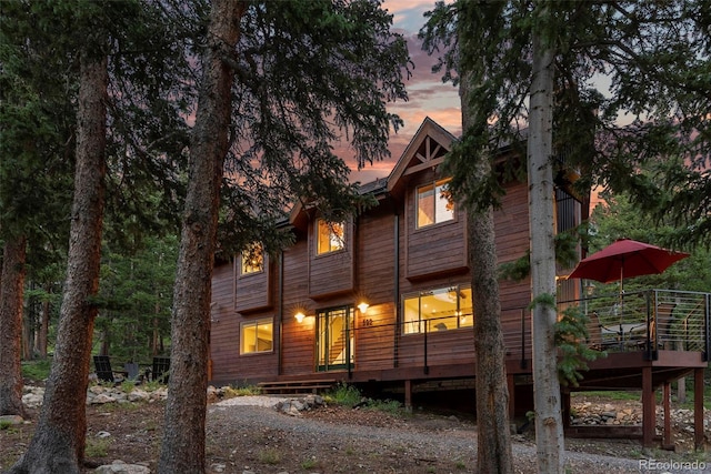 592 Brook Dr, Idaho Springs, CO 80452 - back of property at dusk featuring a wooden deck