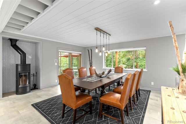 592 Brook Dr, Idaho Springs, CO 80452 - dining area featuring a wood stove and crown molding
